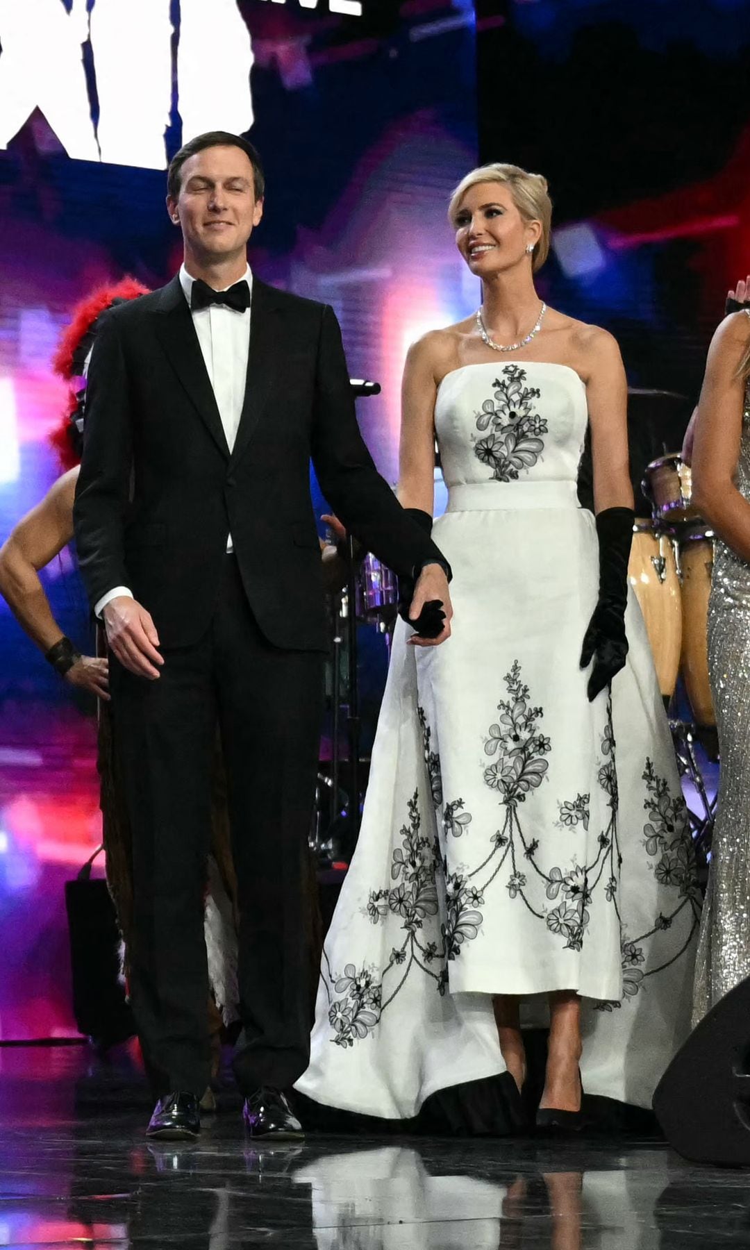 US President Donald Trump (2nd L) stands with First Lady Melania Trump, US Vice President J.D. Vance, Second Lady Usha Vance, Jared Kushner, daughter Ivanka Trump, granddaughter Kai Madison Trump, sons Donald Trump Jr. and Eric Trump, and daughter Tiffany during the Liberty inaugural ball in Washington, DC, on January 20, 2025. (Photo by Jim WATSON / AFP) (Photo by JIM WATSON/AFP via Getty Images)