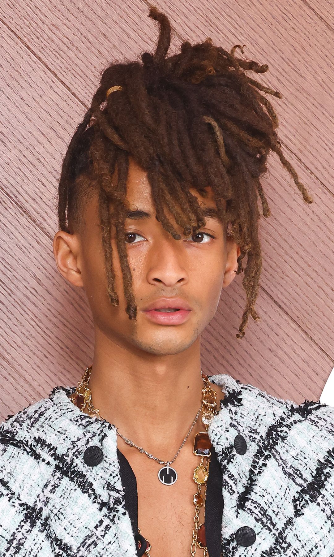 Jaden Smith turns heads in tweed jacket with dramatic sleeves and cinched waist at Paris Fashion Week