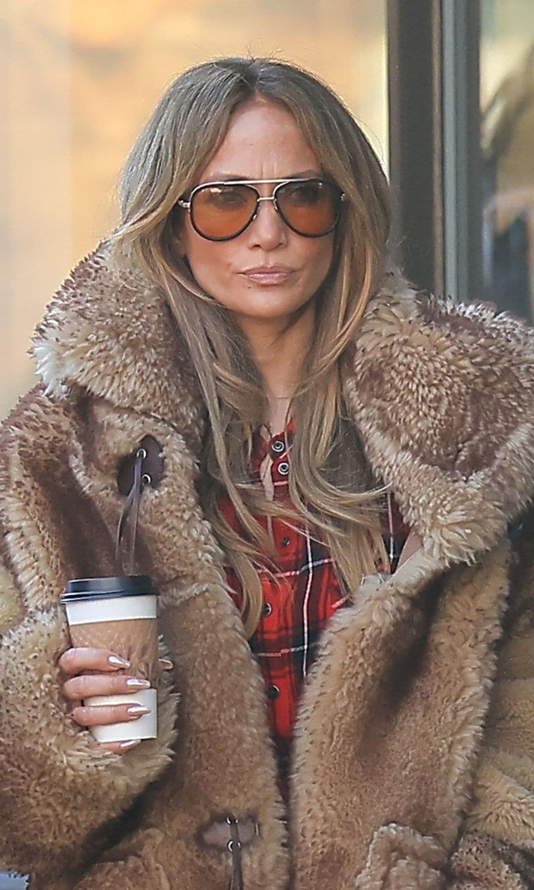 Jennifer Lopez masters the après-ski look in designer winter wear and her engagement ring