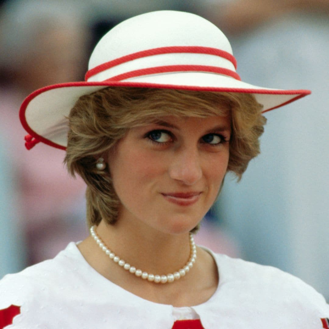 Diana, Princess of Wales, wears an outfit in the colors of Canada during a state visit to Edmonton, Alberta, with her husband.