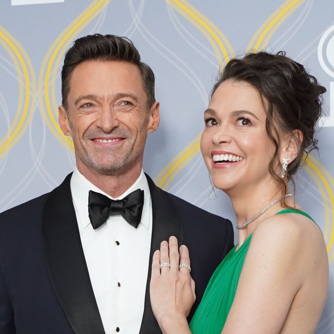 Hugh Jackman and Sutton Foster share a kiss before saying goodbye