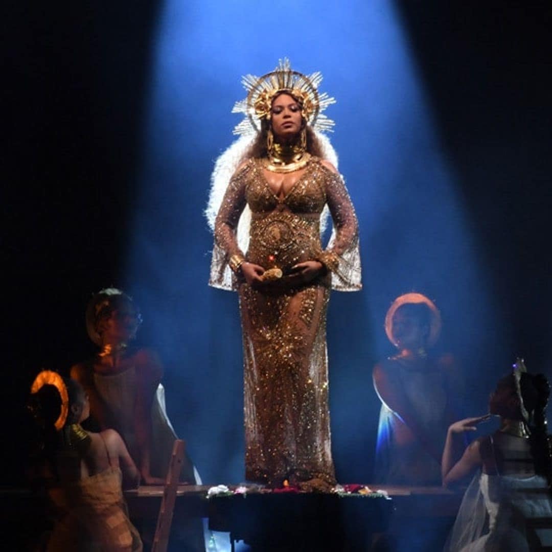 Beyoncé cradles growing baby bump during Grammys performance