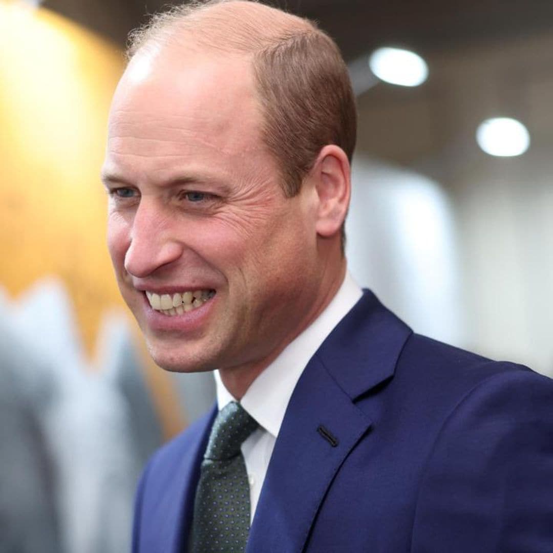 Prince William puts on an apron and prepares food at a Christmas party