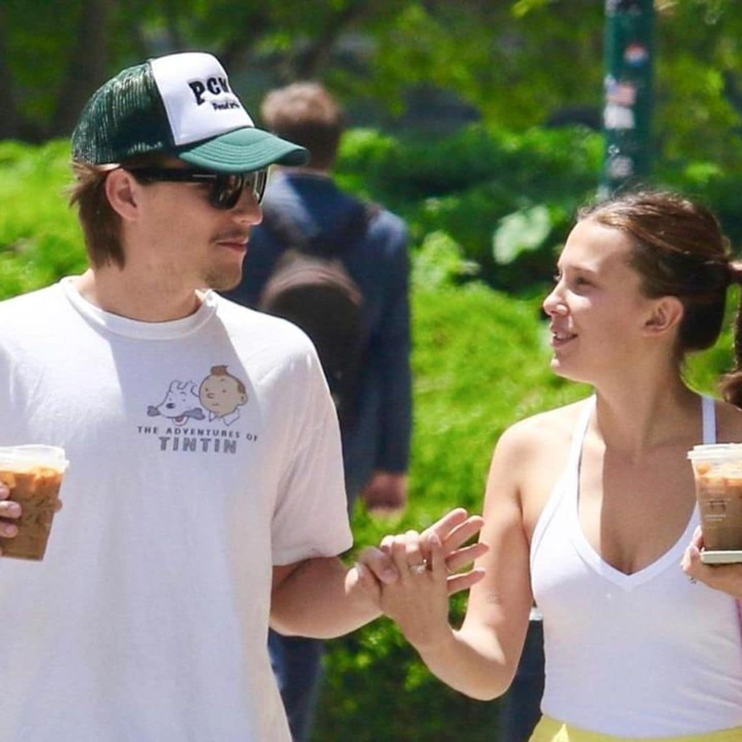 Millie Bobby Brown and Jake Bongiovi share a tender kiss during a romantic stroll