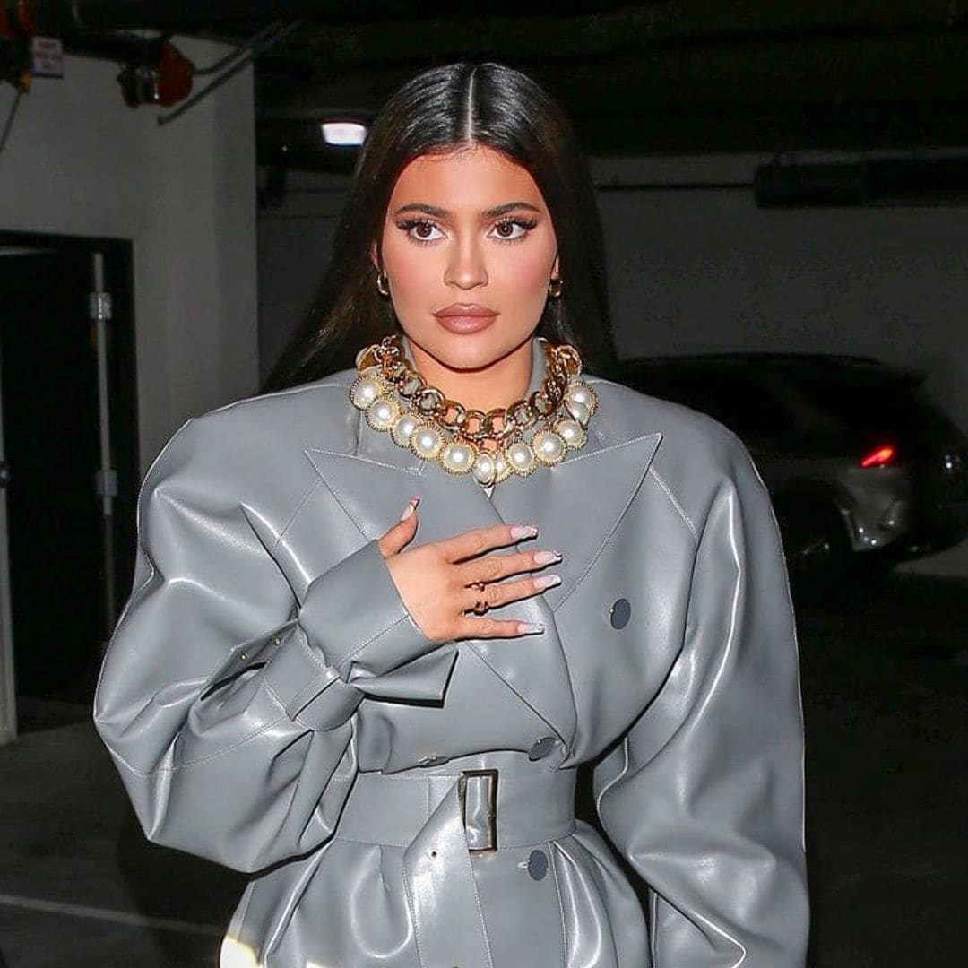 Kylie Jenner stepped out in another trench coat look that was paired with a massive pearl necklace