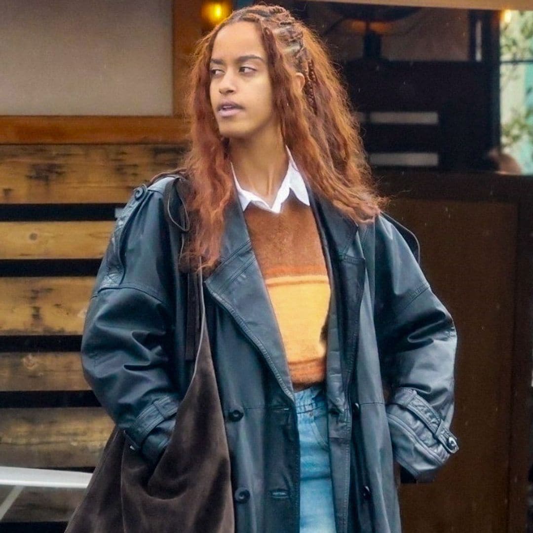 Malia Obama looks effortlessly cool as she pairs a striped sweater with a leather coat