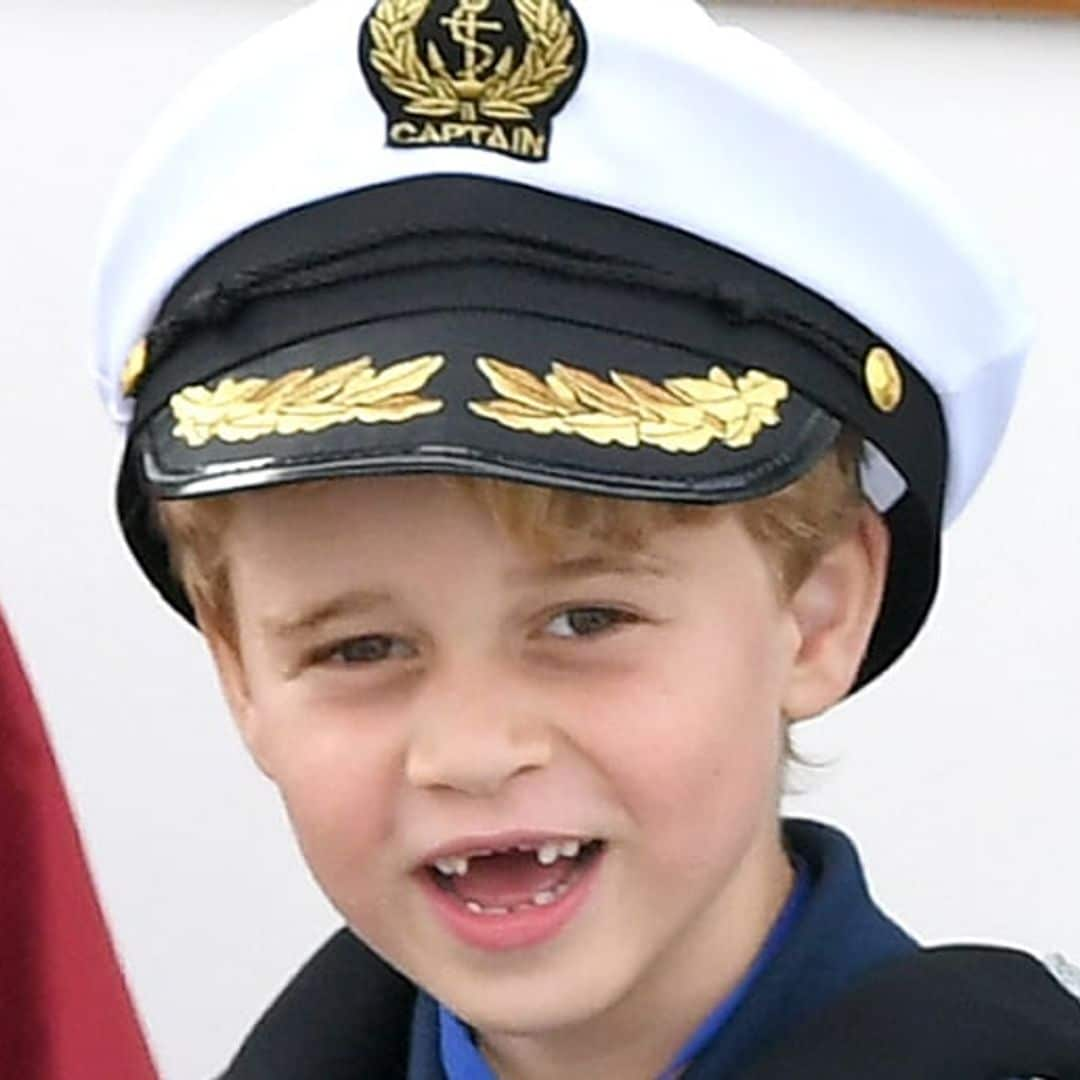 'Sailor' Prince George shows off his missing front teeth