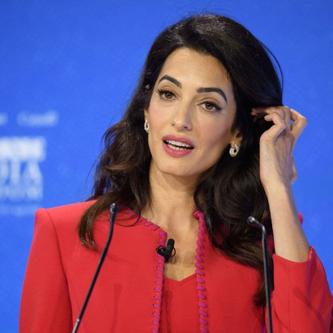 Amal Clooney shows us how to rock two bold statement suits during press conference