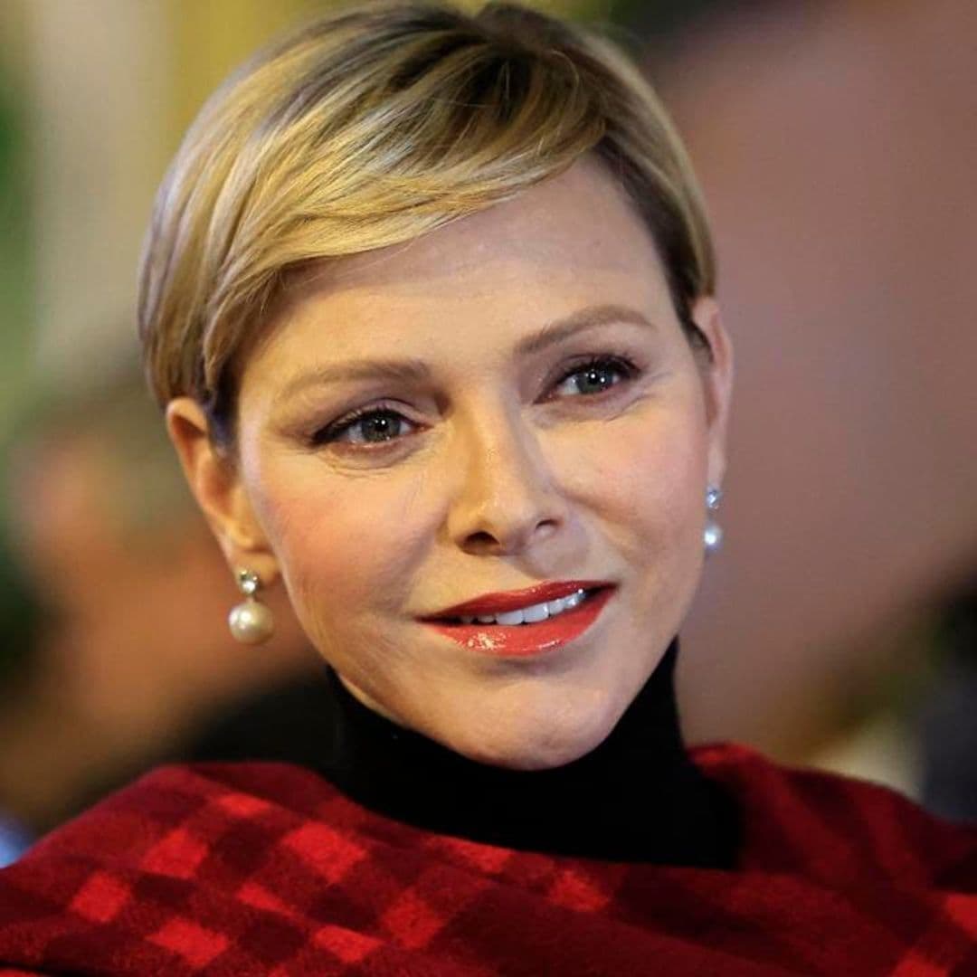 Princess Charlene looks merry in red at inauguration of Christmas village