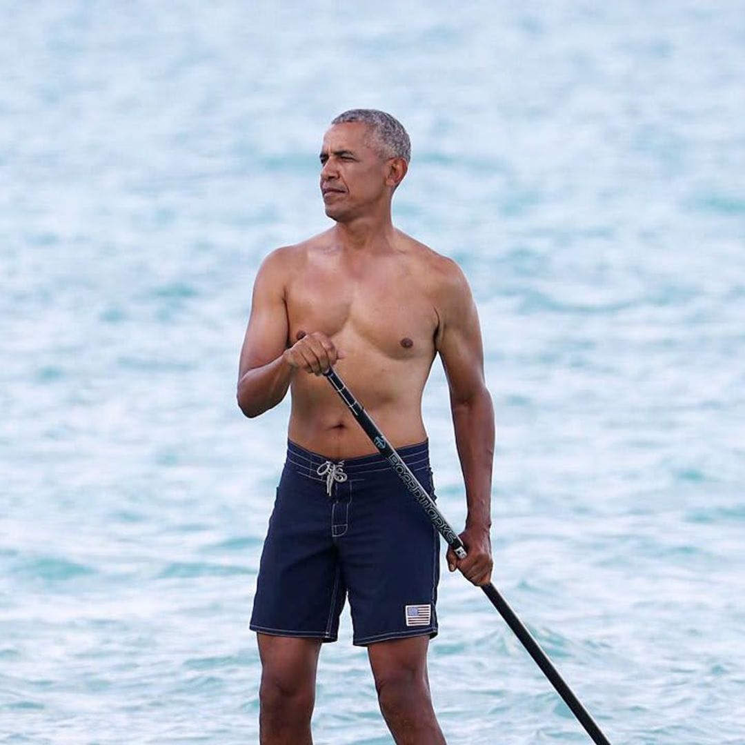 Barack Obama soaks up the sun shirtless in Hawaii