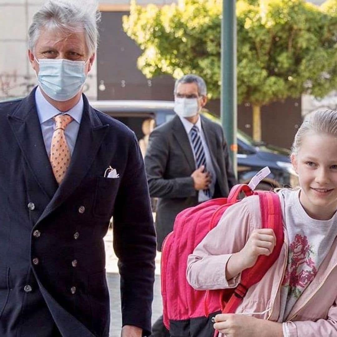 Belgium’s King Philippe stays protected as he escorts Princess Eléonore back to school