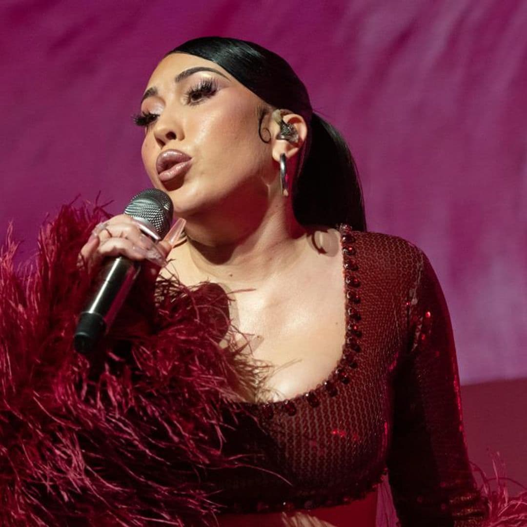 Kali Uchis shows her growing baby bump while performing on Jimmy Kimmel Live!