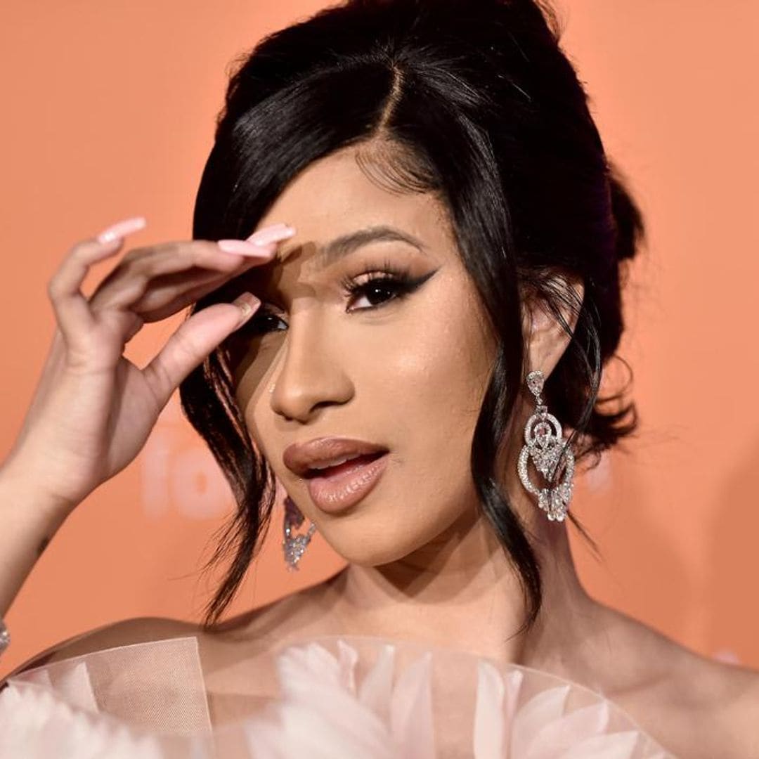 Cardi shows off toned bod in tiny bikini after admitting to weight gain