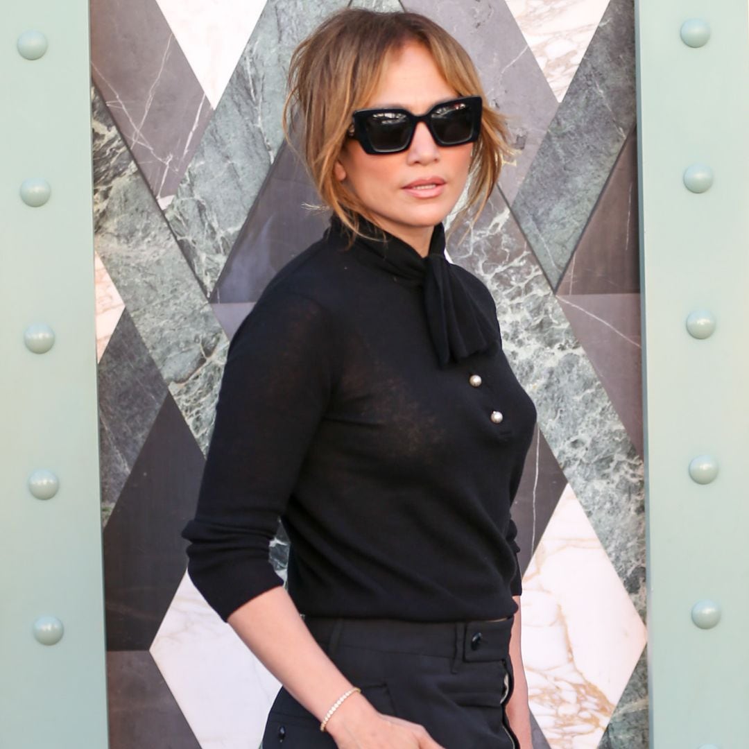 Jennifer Lopez elevates preppy style with sleek polo, flats, and pearls