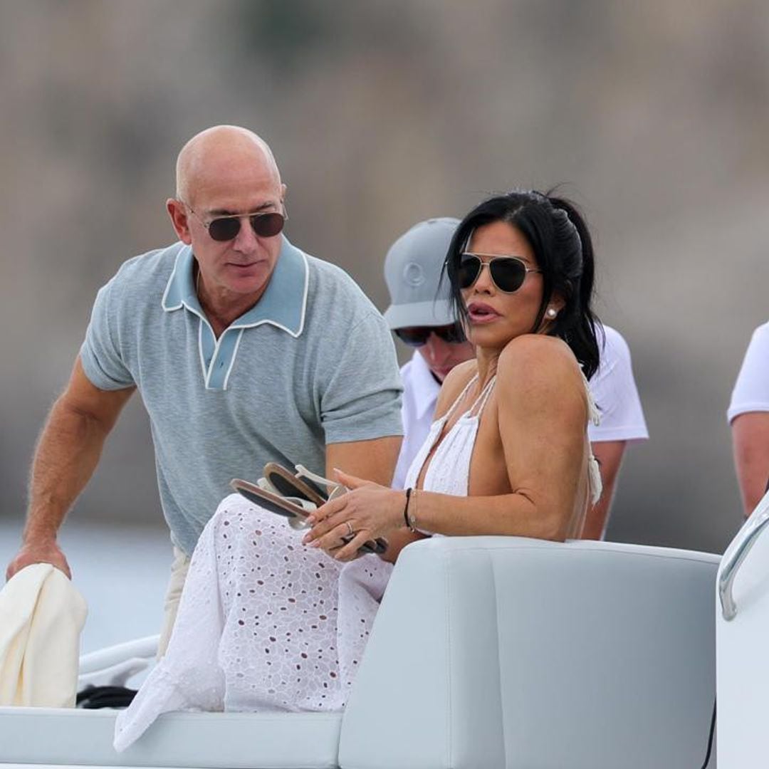 Lauren Sanchez wears a white beach dress in Ibiza with Jeff Bezos