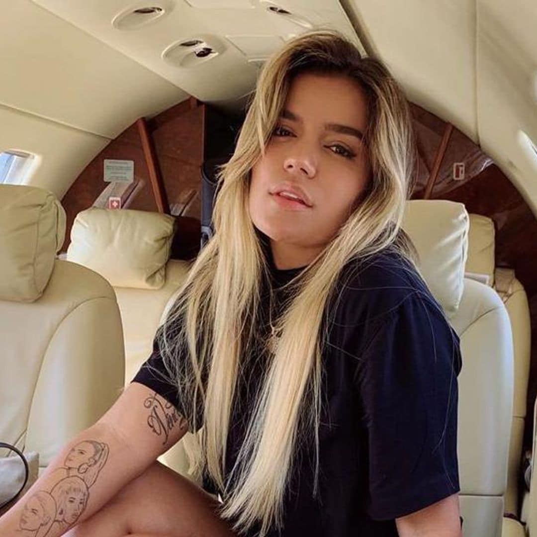 Karol G opens up her impressive closet and shares how she keeps Anuel AA close while away