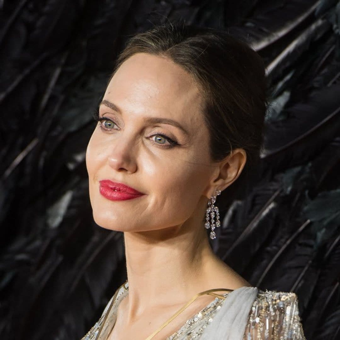 Angelina Jolie hangs out with ex-husband Jonny Lee Miller at his apartment for the second time in a week