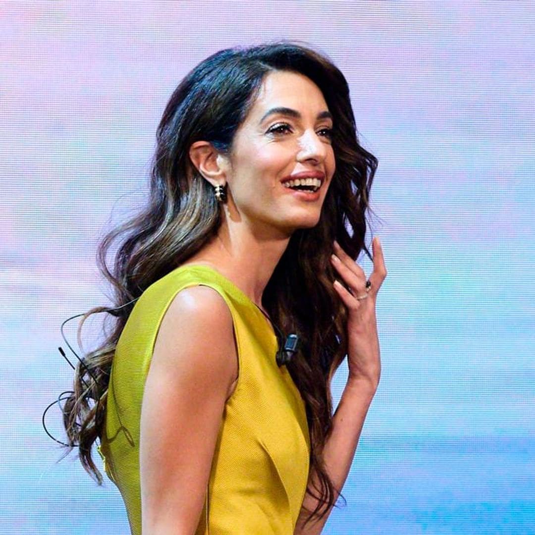 Amal Clooney wears a stunning golden jumpsuit at Madrid conference