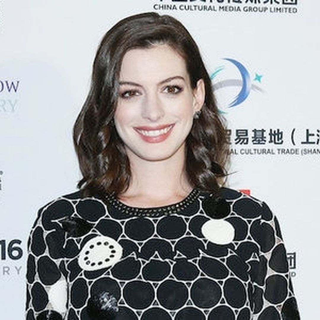 Anne Hathaway shows off her growing baby bump