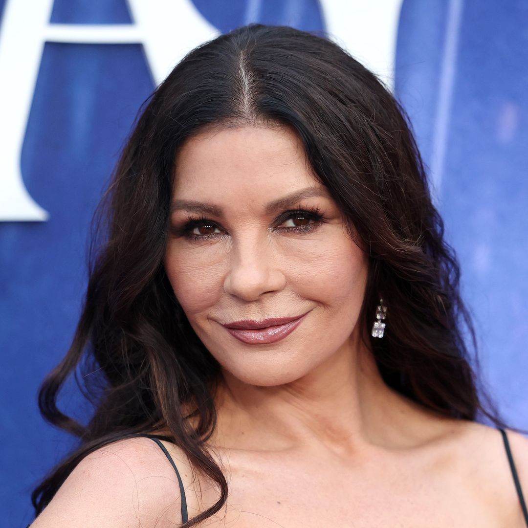 Catherine Zeta-Jones is welcomed home by her dog after months away shooting 'Wednesday'