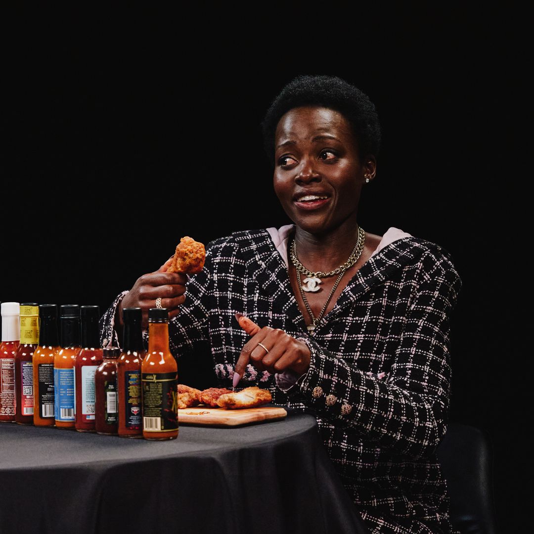 Lupita Nyong'o eats hot wings while discussing her fear of cats and scary movies