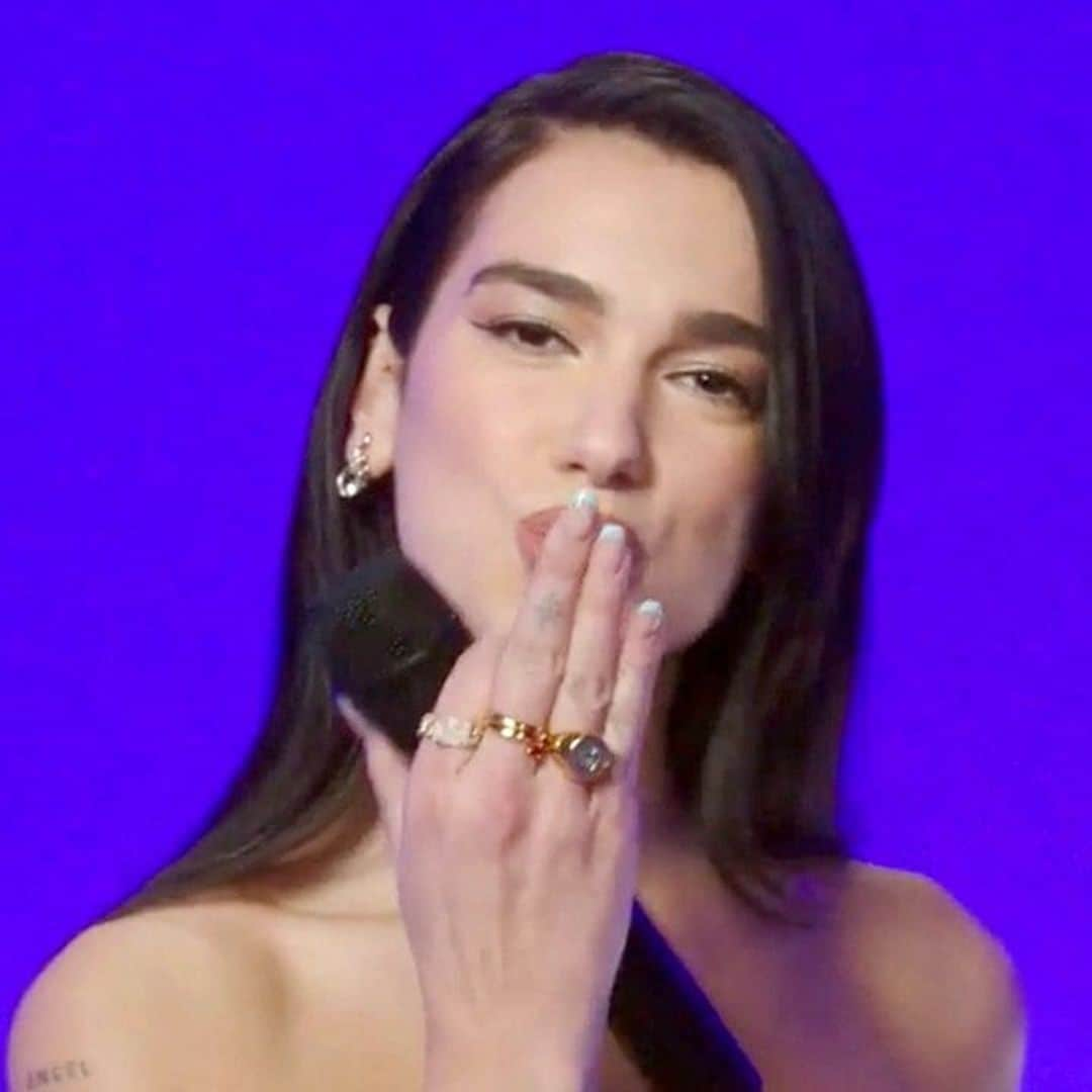 Dua Lipa shows sun-kissed skin in a cut-out mini dress