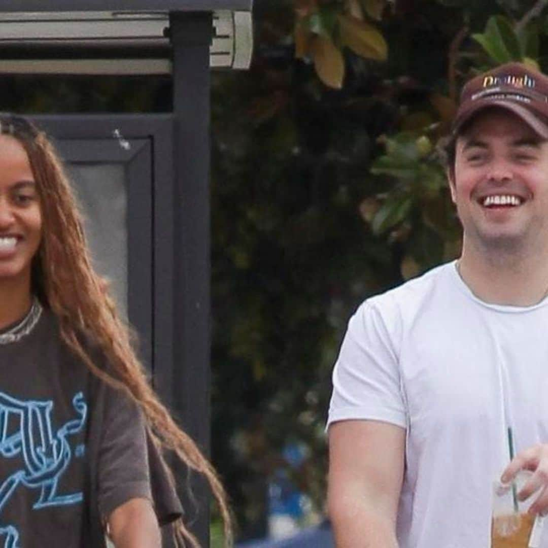 Malia Obama giggles with a friend while wearing the perfect fall look