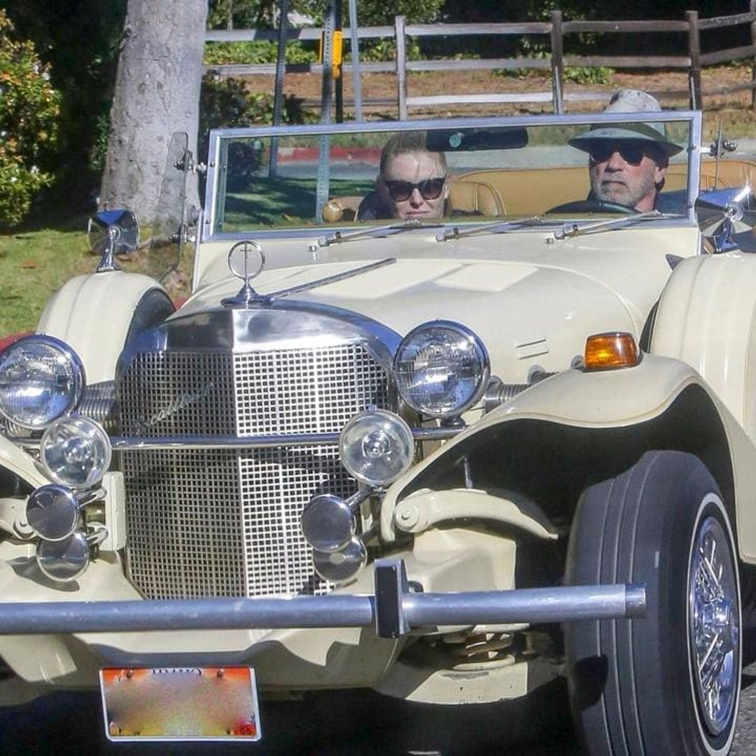 Arnold Schwarzenegger takes girlfriend Heather Milligan for a ride in his vintage Mercedes