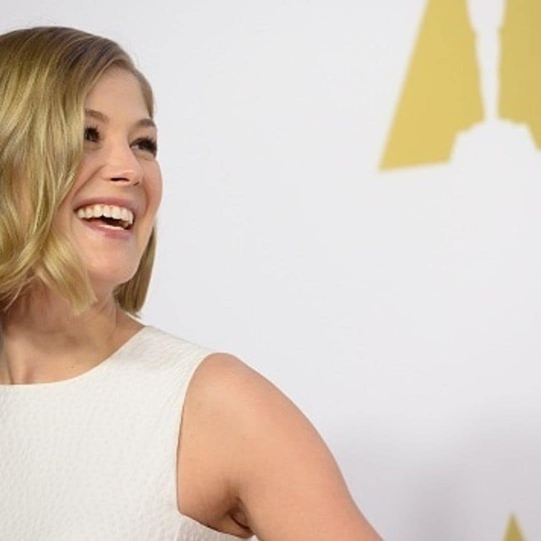 Rosamund Pike is a vision in white at Oscars Nominee Luncheon