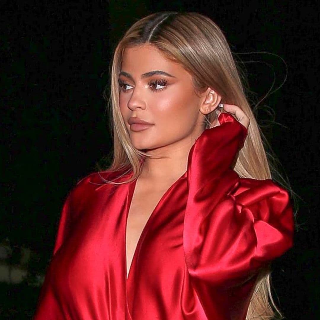 Kylie Jenner turned heads in a fiery red and bright orange outfit while going to dinner