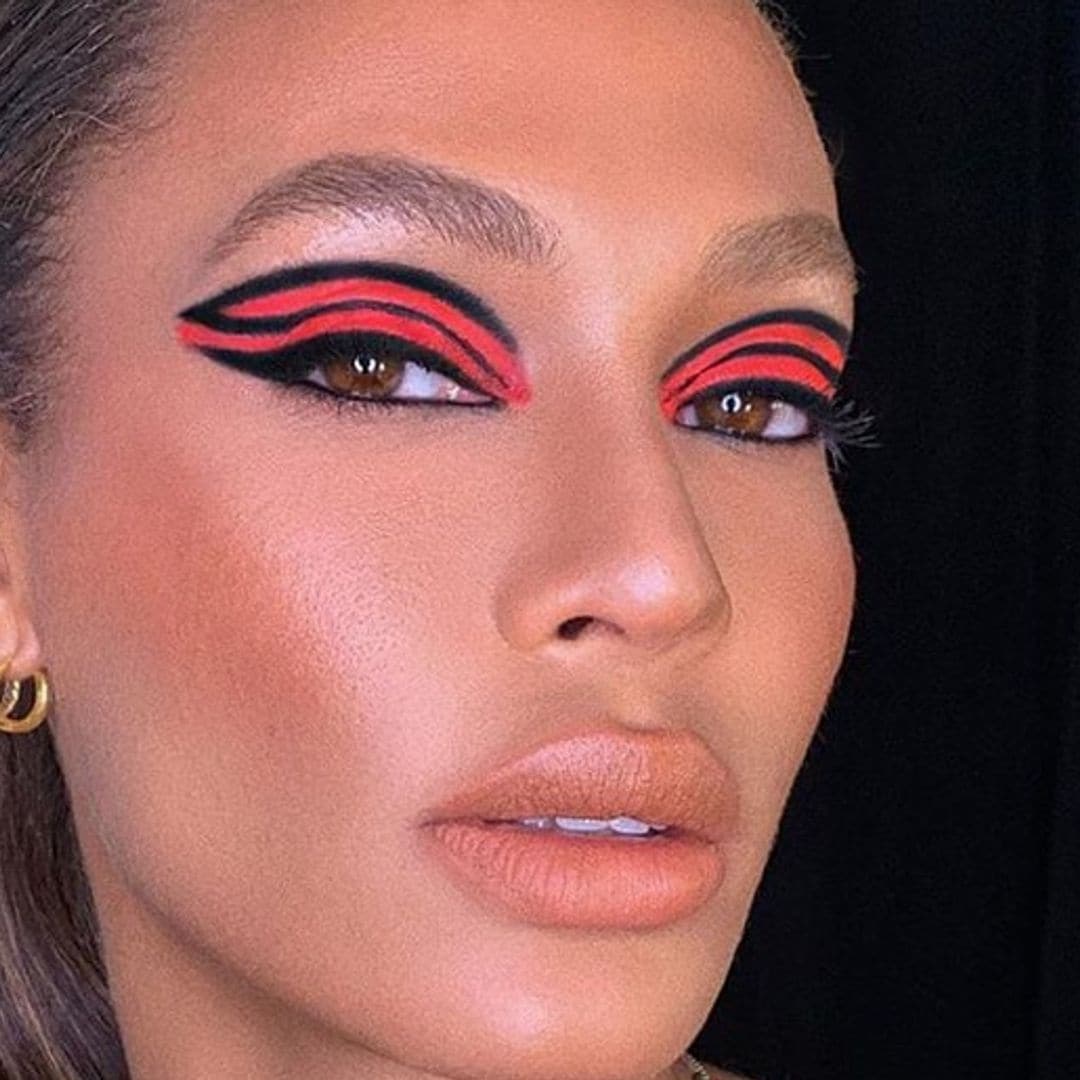 Joan Smalls’ bold orange makeup is totally on trend for summer