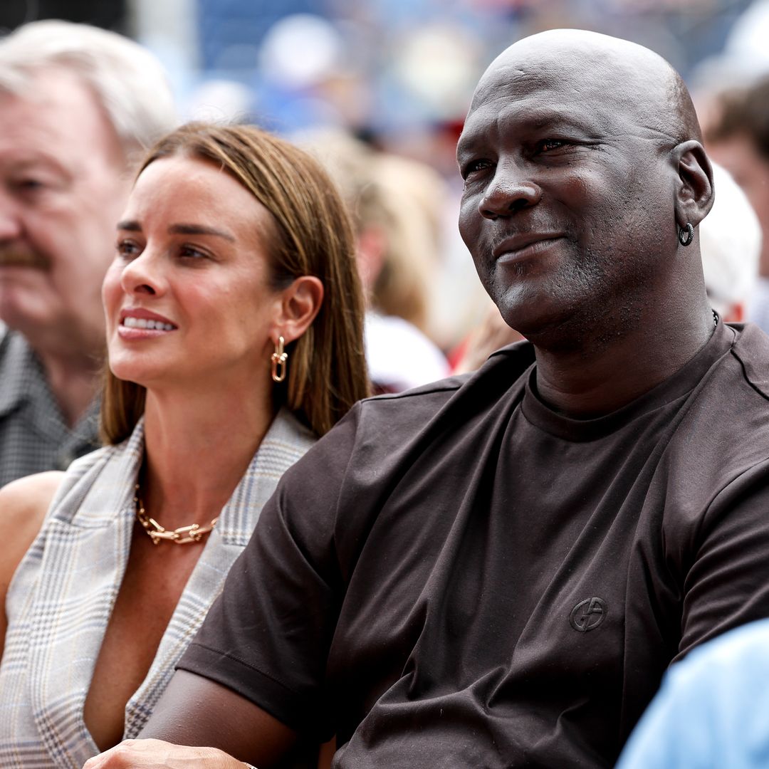 Michael Jordan and Yvette Prieto playfully dance while on vacation