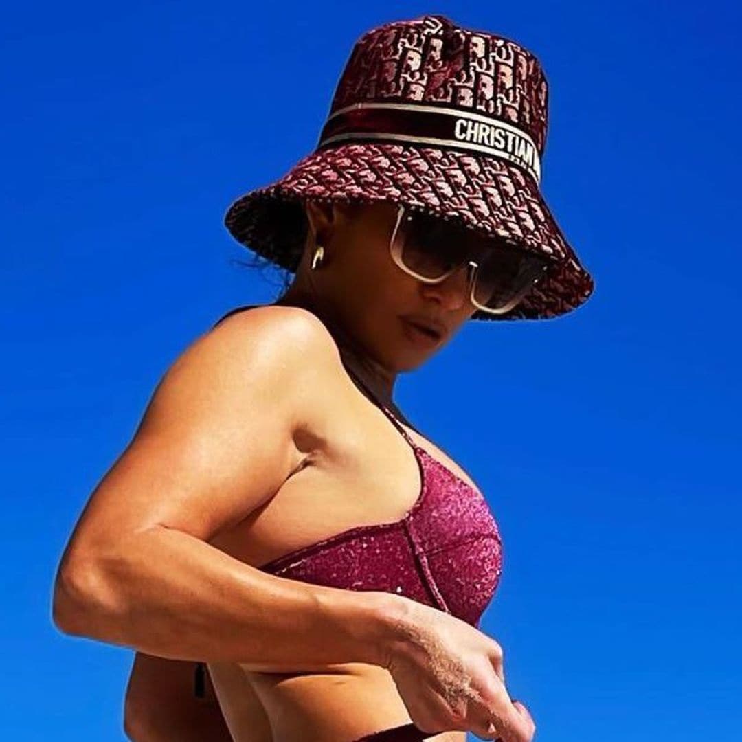 Jennifer Lopez’s ‘beach bum’ is sparkling in a purple bikini