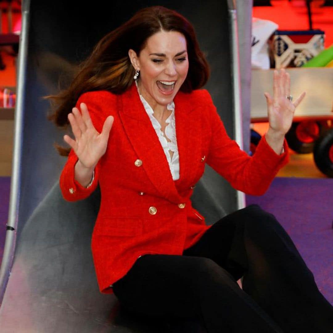 Kate Middleton goes down a slide in pumps: Watch the fun video