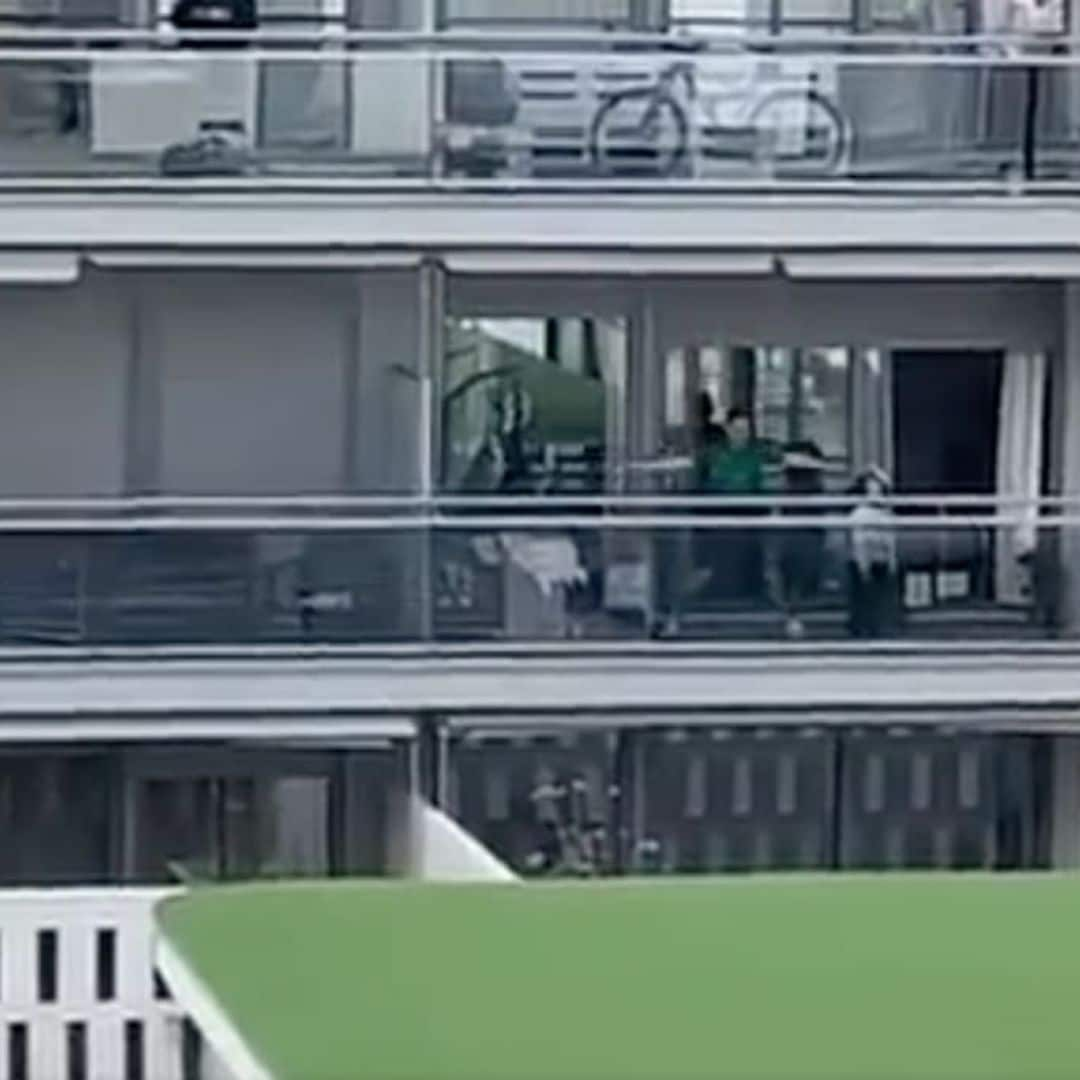 Trainer hosts workout from roof as people follow on balconies in quarantined Spain