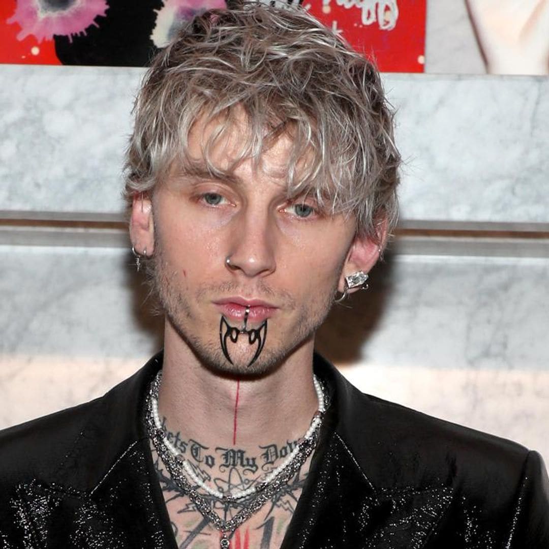 Machine Gun Kelly covers his upper body with massive blackout tattoo