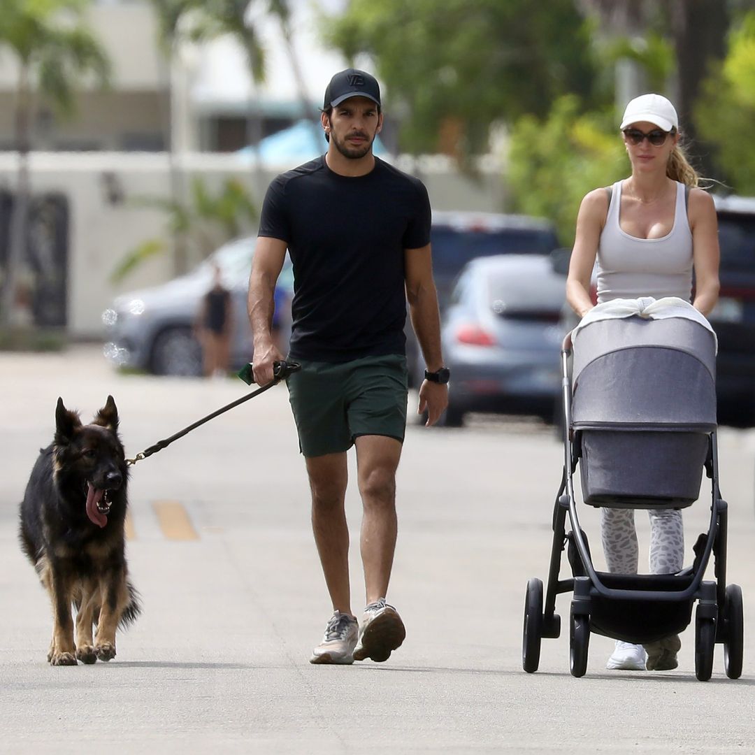 Gisele Bündchen and Joaquim Valente share a kiss as they walk their newborn baby boy