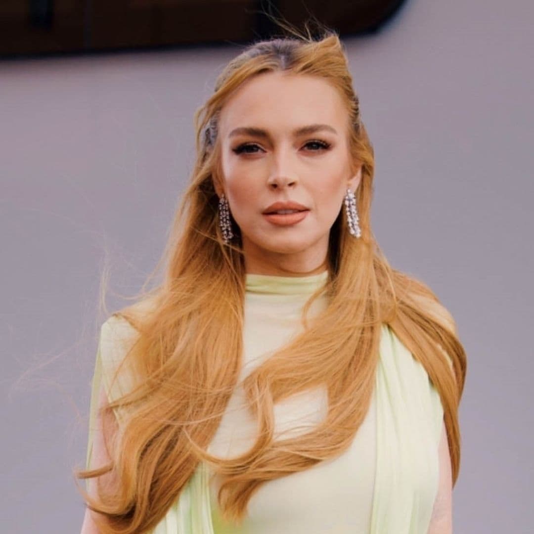 Lindsay Lohan shows off glamorous look including metallic heels and diamond earrings