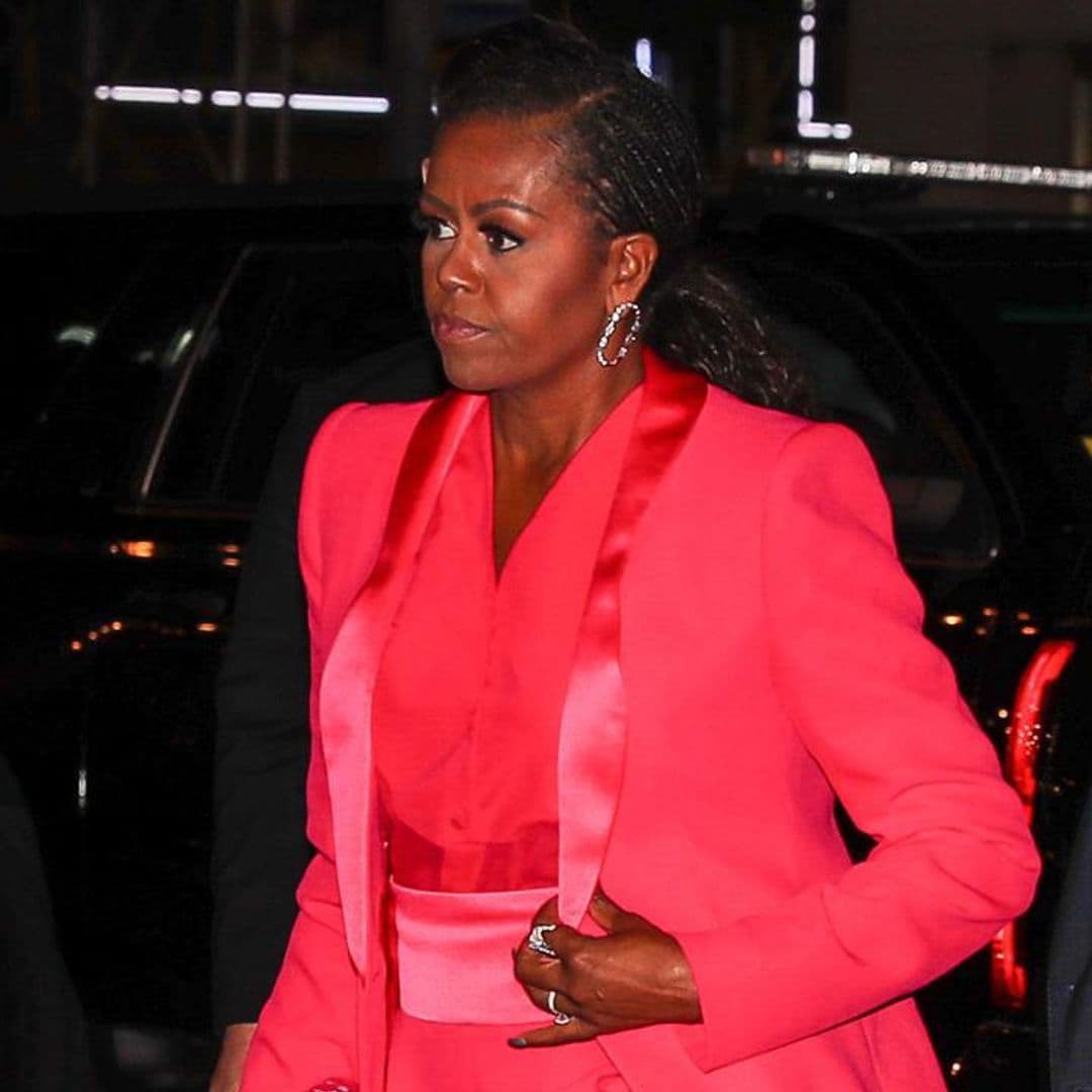 Michelle Obama looks stunning in a pink power suit