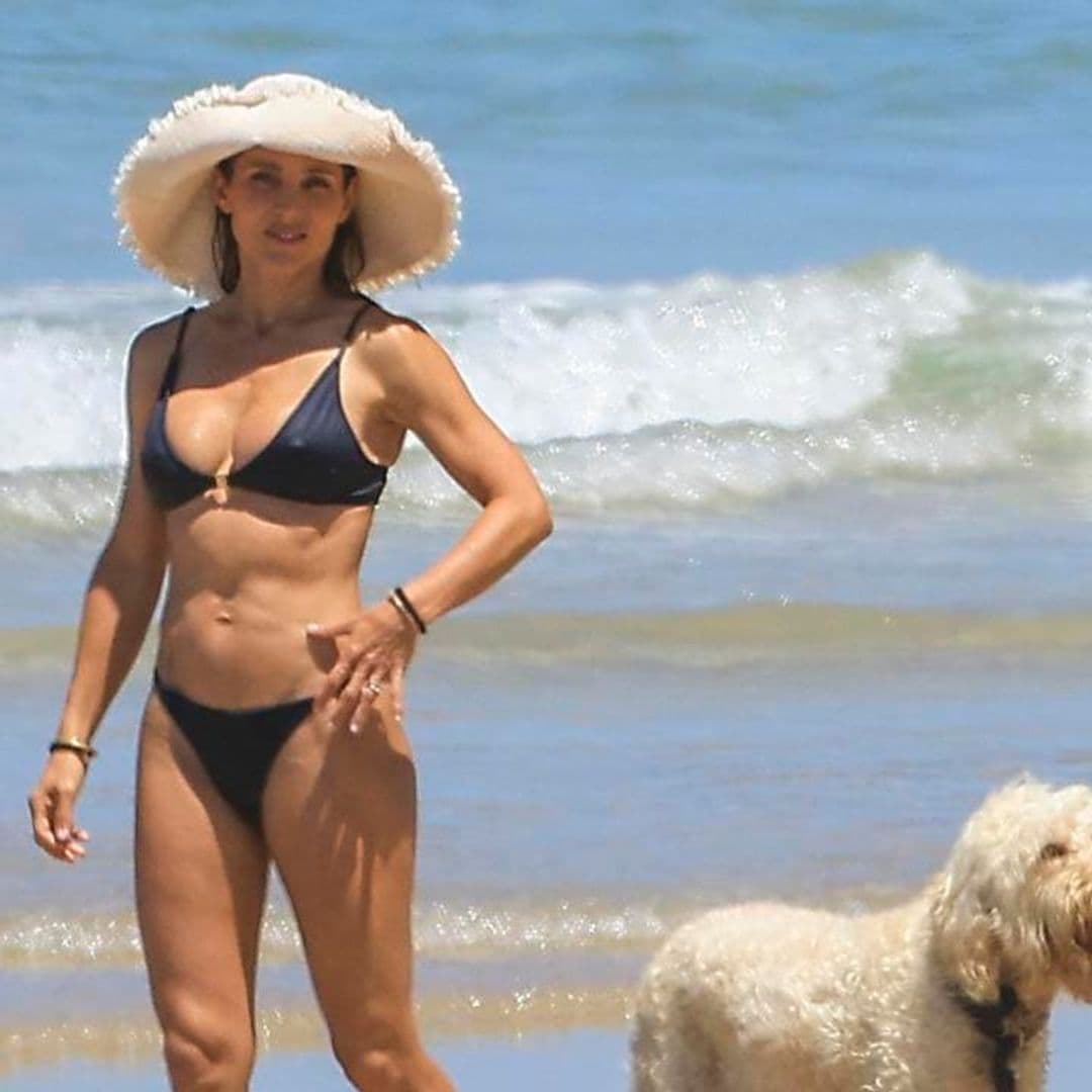 Elsa Pataky looks stunning in a bikini as she returns home from her trip