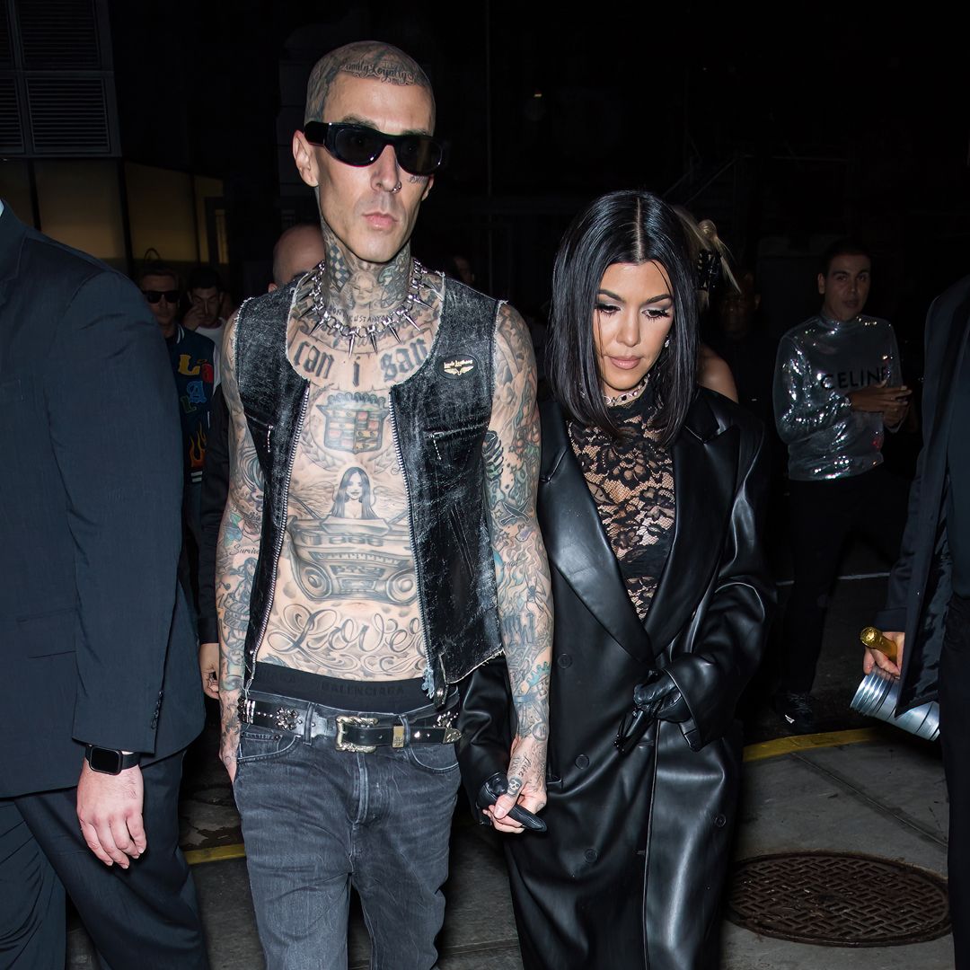 Kourtney Kardashian and Travis Barker celebrate the holidays with family in all-black outfits