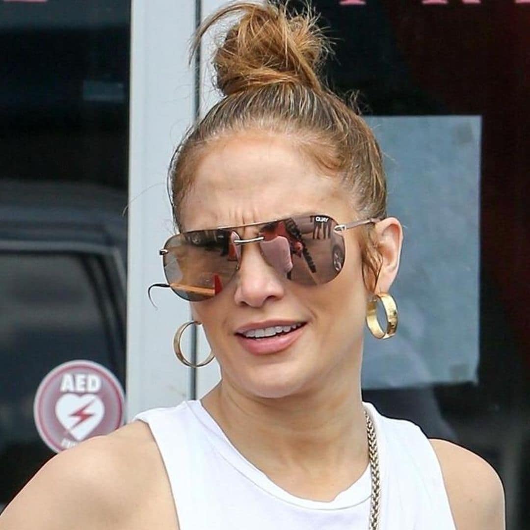 Jennifer Lopez’s monogrammed tracksuit and neon yellow mini bag is the most extra gym outfit