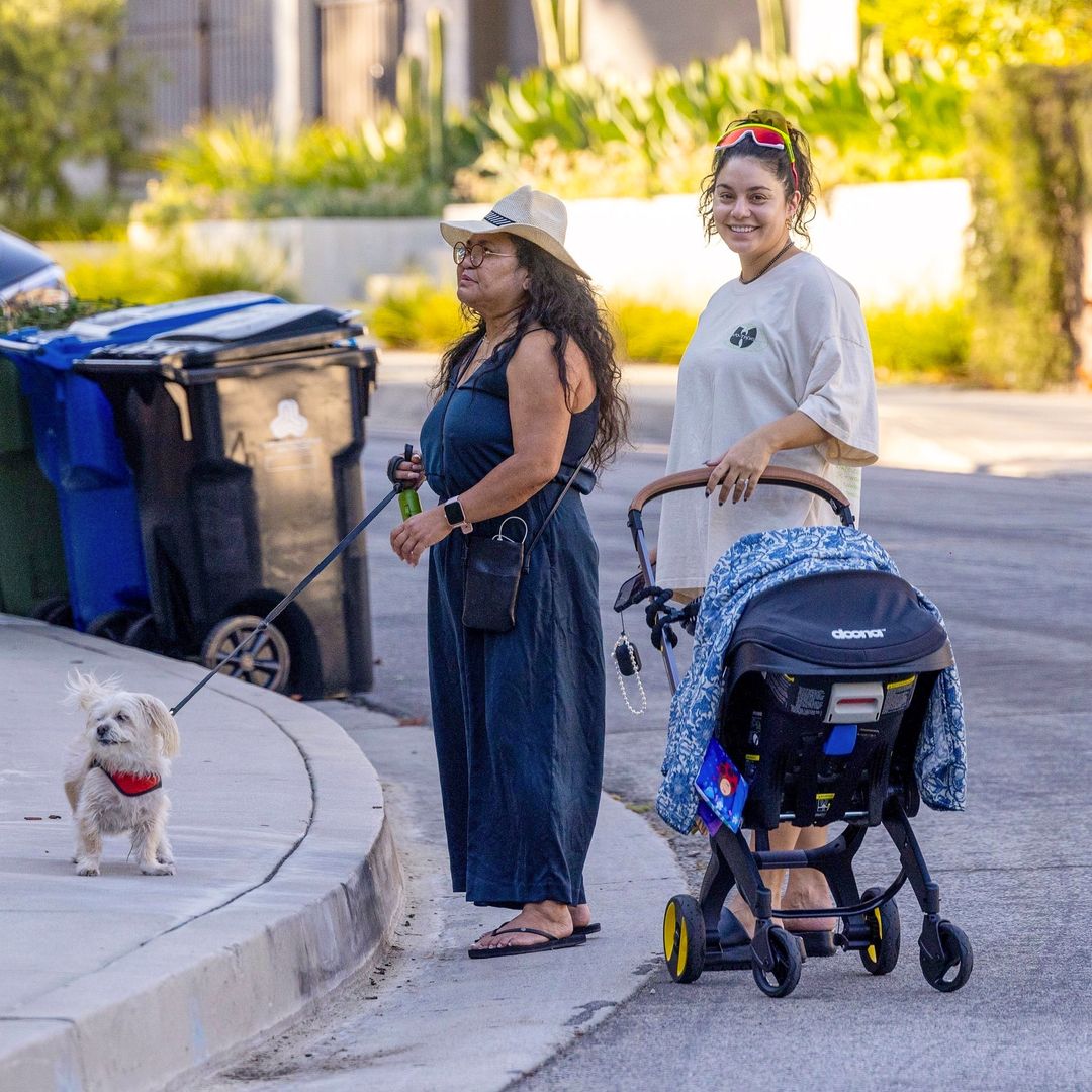 Vanessa Hudgens radiates on a walk with her mom and newborn baby