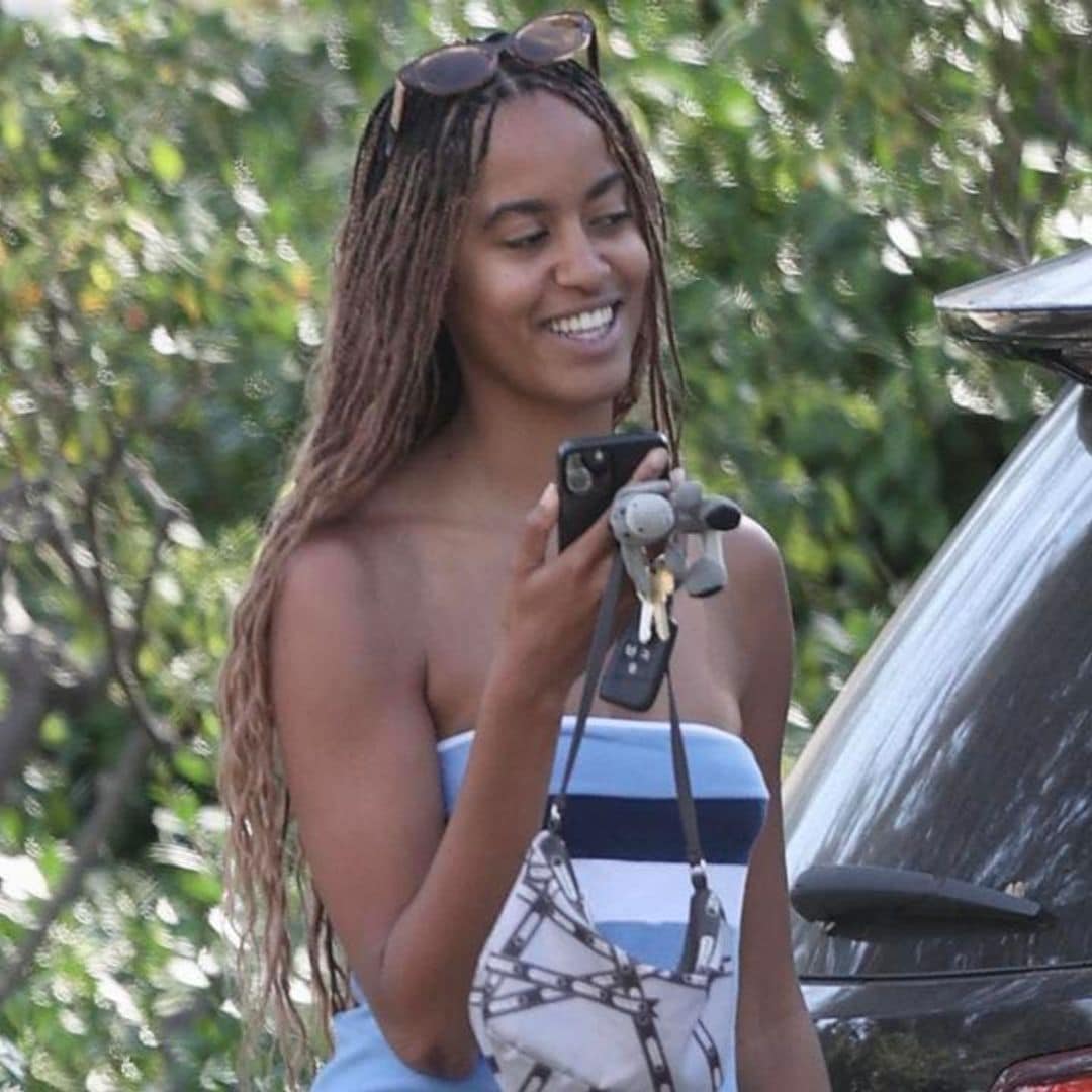 Malia Obama channels 2000s fashion in strapless blue mini dress and chunky boots