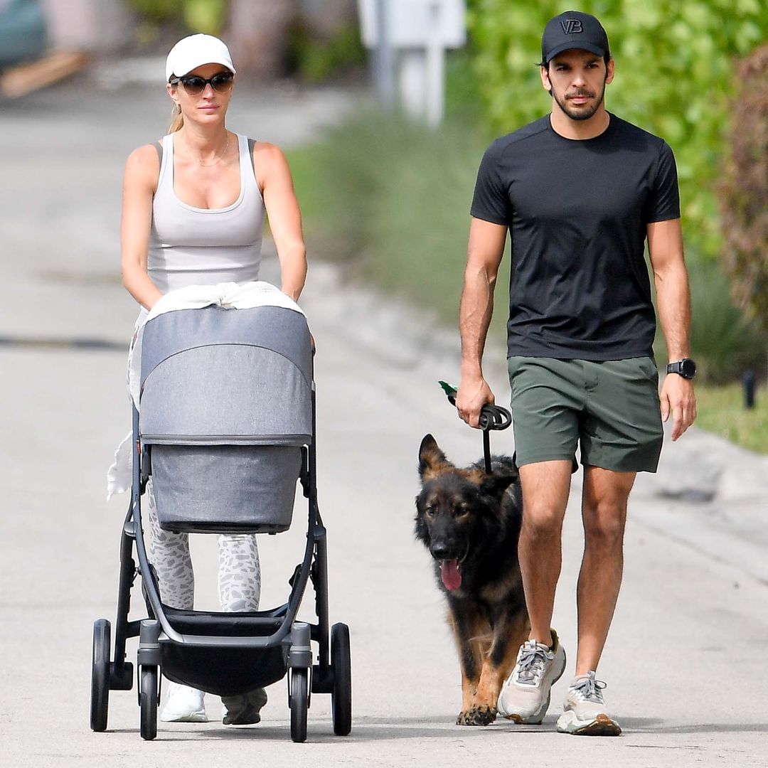 Gisele Bündchen and Joaquim Valente share a kiss as they walk their newborn baby boy