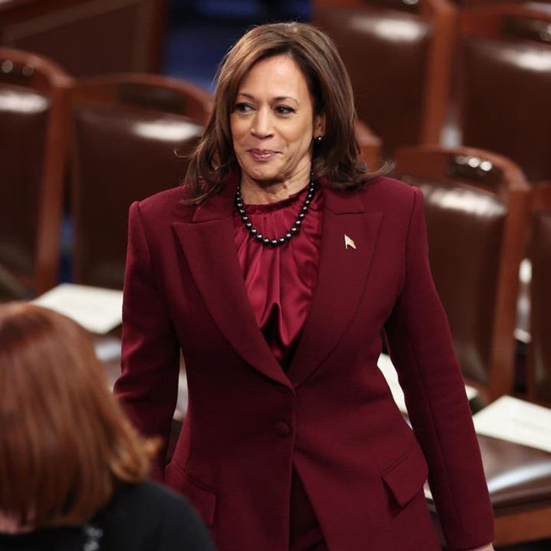 Vice President Kamala Harris wears a maroon suit designed by Christian Siriano