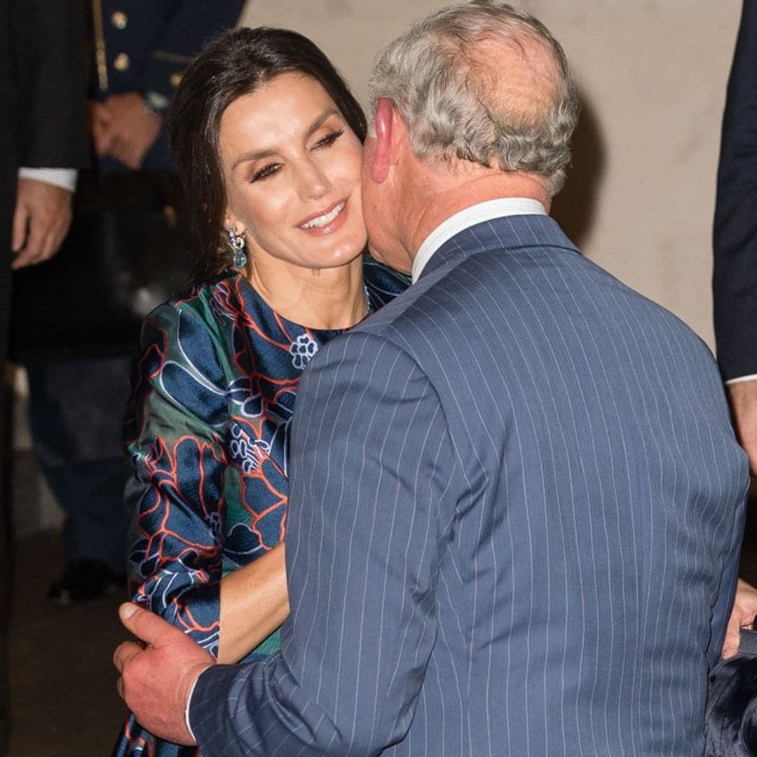 Queen Letizia gets a kiss on the cheek from Prince Charles on stylish night out