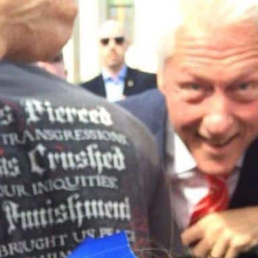 Too cute: Bill Clinton photobombs sad little girl