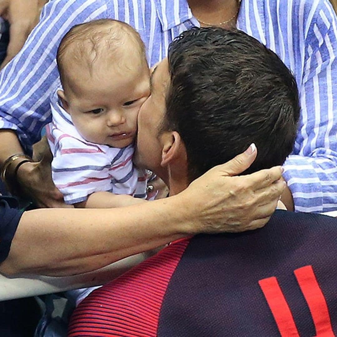 Michael Phelps celebrates Olympic gold with a kiss for baby Boomer