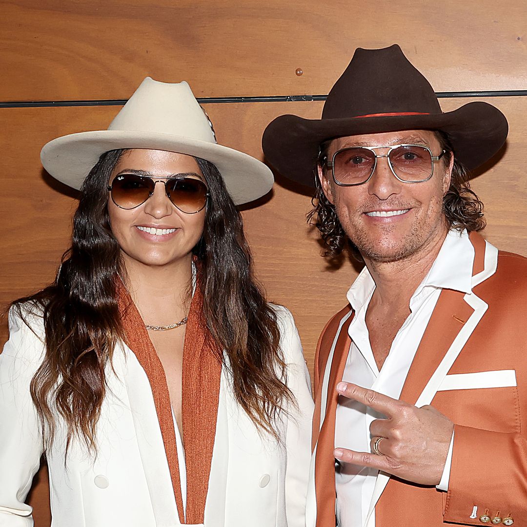 Matthew McConaughey and Camila Alves wear matching cowboy hats as they root for the Texas Longhorns